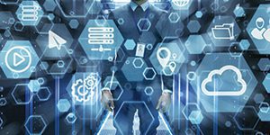 IT Engineer Standing in the Middle of a Working Data Center Server Room