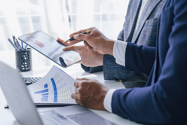 two people auditing papers